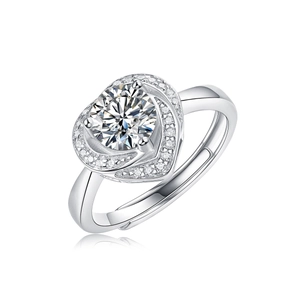 Detailed macro view of heart-shaped halo ring setting with a round main stone in silver