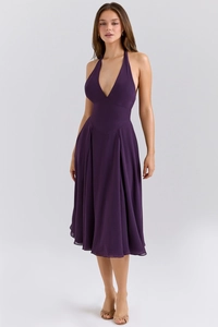 Detail of dark purple halter neck maxi dress with deep V-neck and pleated A-line skirt