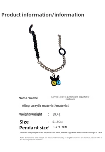 Detail of acrylic cat pendant with bicolored eyes and black bead chain necklace