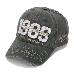 Detail of 1985 3D embroidery on washed cotton baseball cap with vintage distressed edges