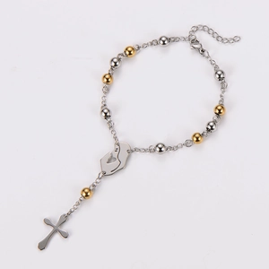 Detailed view of silver and gold rosary bracelet with Virgin Mary medal and crucifix