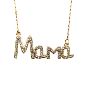 Detailed close-up of golden Mama letter pendant with sparkling micro-inlaid zircon stones