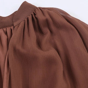 Bohemian brown chiffon maxi dress featuring ruffle trim and flowing pleated texture fabric