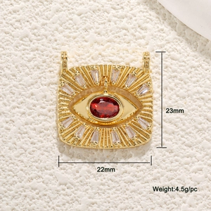 Detail view of gold evil eye pendant showing 23x22mm size dimensions and 4.5g weight