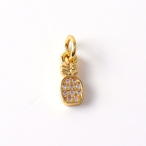 Detail of gold pineapple pendant with inlaid crystals and top hanging ring attachment