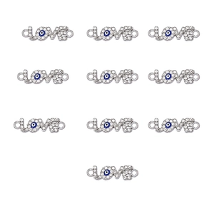 Macro view of 10 silver Love connectors with crystal rhinestones and evil eye for DIY