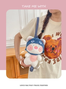 Detail of cute shark cat plush crossbody bag with soft faux fur and adjustable blue strap