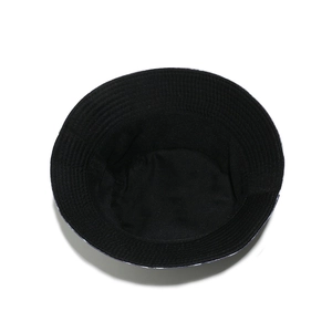 Detailed top view of a black canvas bucket hat showing internal seams and stitched brim