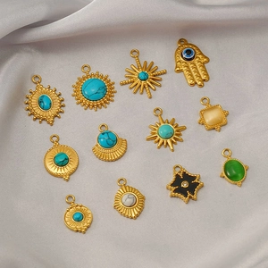 Detailed set of twelve gold titanium steel pendants with turquoise and natural stones