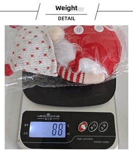 Gnome plush toy with red knitted heart hat and white beard shown weighing 88g