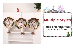 Detail of Christmas wreath with Santa and Reindeer dolls and Merry Welcome signs