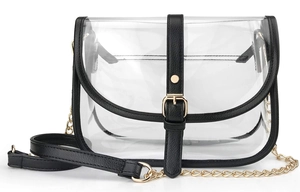 Detail of transparent PVC saddle bag with black faux leather trim and gold chain strap
