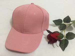 Close-up of the breathable six-panel structure and curved brim on a pink baseball cap