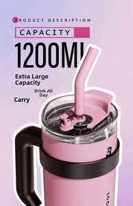 Detail of 40oz pink insulated tumbler with black ergonomic handle and straw lid