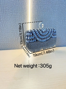Detail of navy blue rhinestone evening clutch showing dimensions 19x13x5.5cm and weight