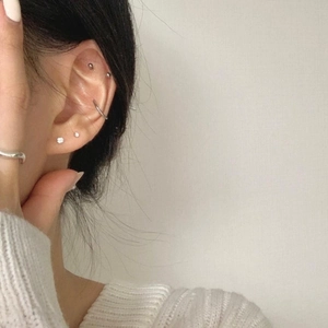 925 silver stud earrings and hoop set for multiple piercings worn by a model