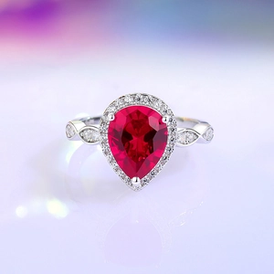 Pear cut ruby red gemstone ring in S925 sterling silver with halo cubic zirconia accents