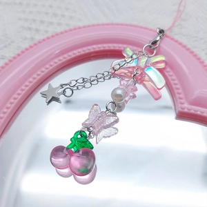 Sweet pink cherry phone charm with translucent butterfly and star pendant on mirror