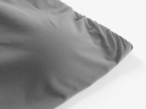 Detailed macro view of dark grey high-stretch seamless fabric texture and soft skin feel