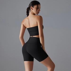 Detail view showing high-waisted fitness shorts and back design of black yoga set