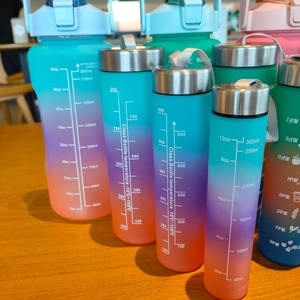 Set of 4 gradient matte sports water bottles with time markers and portable straps