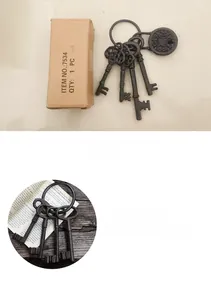 Detail of vintage cast iron key ring set with rustic brown finish in original box