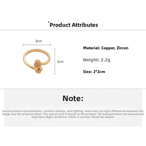 Macro detail of 18k gold plated heart ring with zircon inlay and product dimensions