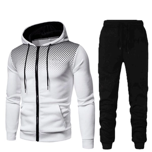 Detail of white hoodie with black gradient dots on shoulder and matching track pants