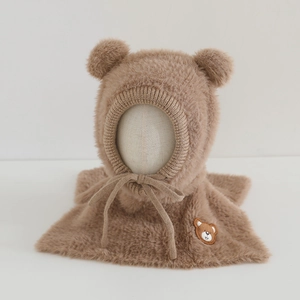 Detail of soft faux mink fur bear ears hood with delicate bear embroidery on the scarf
