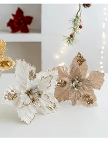 Detailed close-up of velvet poinsettia petals with gold sequins and festive glitter