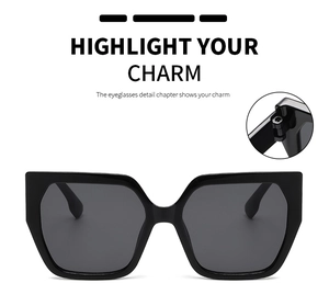 Detailed macro view of the durable metal hinge on these oversized black square sunglasses