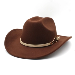 Detail of dark brown wool felt cowboy hat featuring a horseshoe buckle on the band