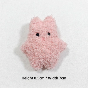 Pink plush rabbit charm accessory showing 8.5cm by 7cm dimensions with curly fleece texture