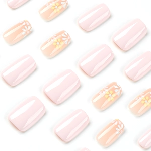 Pink press-on nails set with solid gloss finish and delicate daisy flower patterns