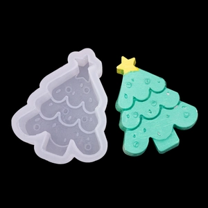 Christmas tree silicone mold for scented candles and cakes on black background