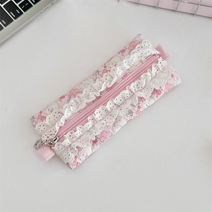 Detail of pink floral pencil case with delicate white lace trim and zipper closure