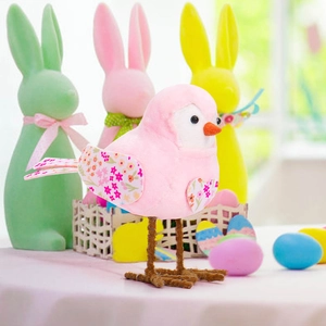Detail of pink Easter bird ornament with floral wings and textured fabric finish
