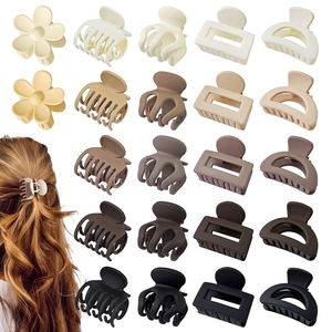 Matte hair claw clips in neutral colors featuring flower, square and crescent shapes