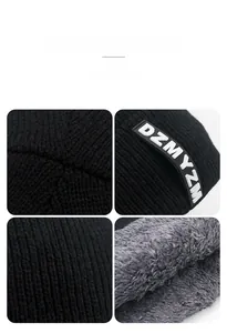 Detail view of winter knitted hat with thick gray fleece lining and black ribbed texture