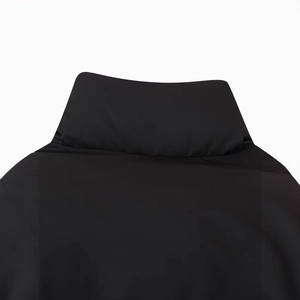 Women's cropped puffer jacket with stand collar and detailed black fabric texture