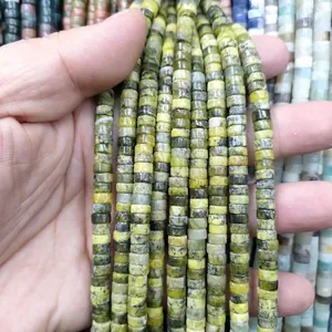 Macro shot of natural green disc stone beads for DIY jewelry making accessories