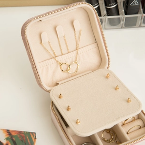 Portable velvet jewelry travel case with necklace hooks and multi-compartment storage