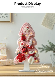 Detail of pink wool felt Christmas tree with LED lights and cute plush ornaments