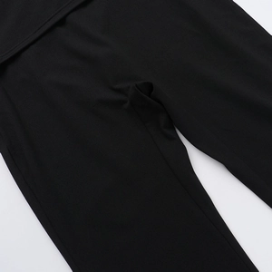 Close-up of the professional stitching and fabric texture on black trousers