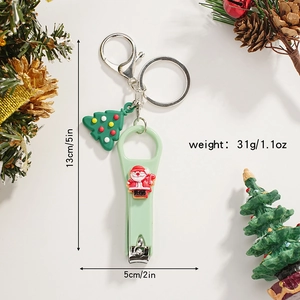 Detail of Christmas Santa nail clipper keychain with dimensions 13cm and festive tree pendant