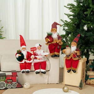 Set of four sitting Santa Claus and elf figurines for festive indoor Christmas decor