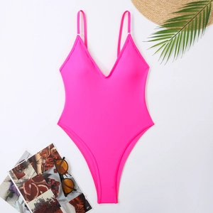 Deep V-neck fluorescent pink one-piece swimsuit with high-cut leg on summer background