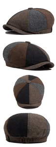 Detail view of herringbone newsboy cap showing wool blend fabric and decorative metal buttons