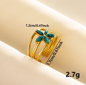 Gold stainless steel flower ring with blue stone and woven texture detail, weighing 2.7g