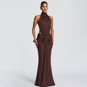 Detail of elegant brown halter evening dress with waist cut-outs and draped abdominal detail